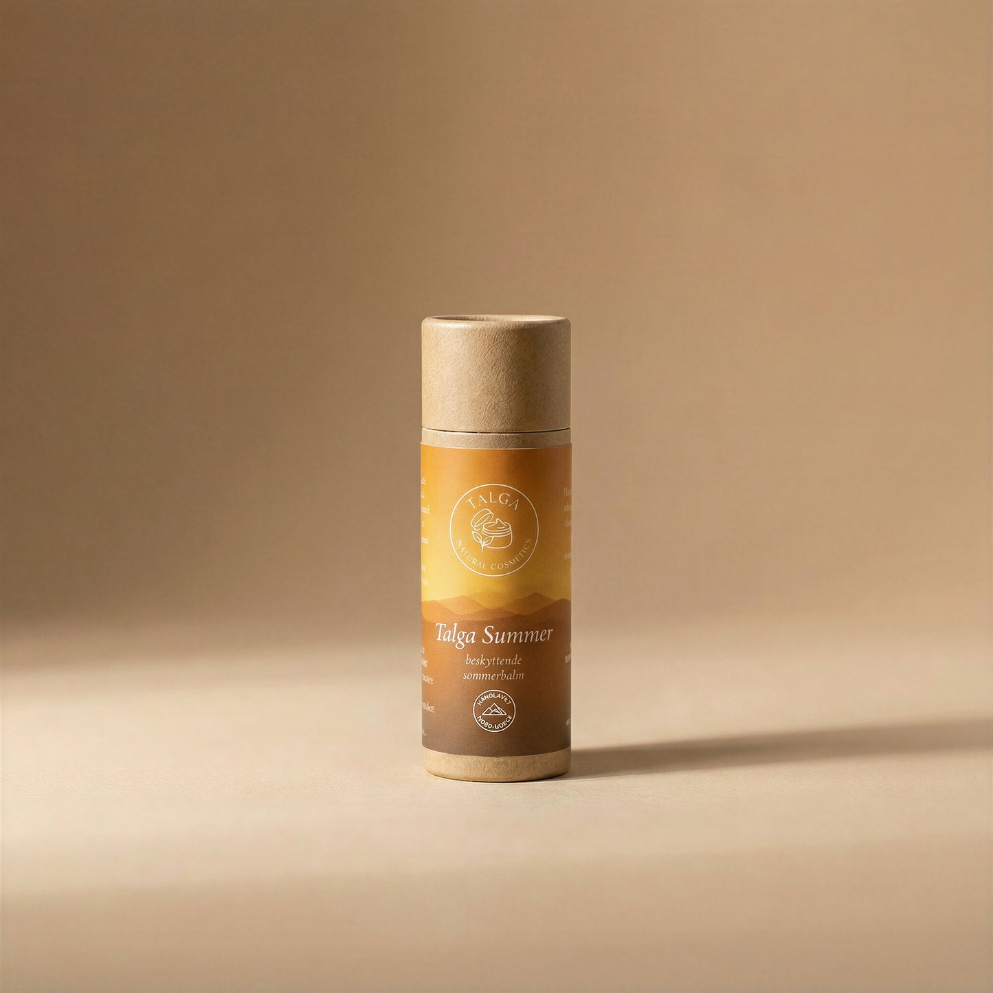 Talga Summer protective balm stick in a paper tube on a beige background.